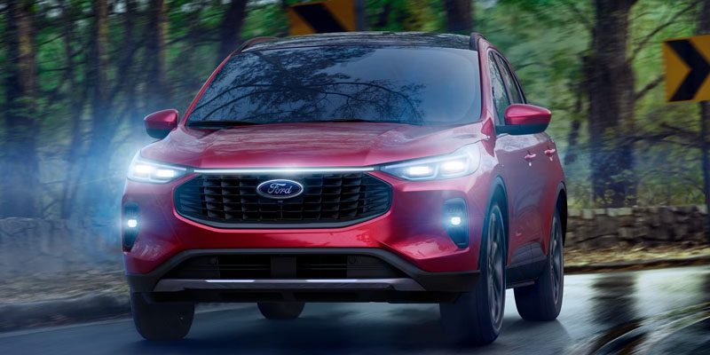 The 2025 Ford Escape headlights brightening the path in New Hudson, MI 