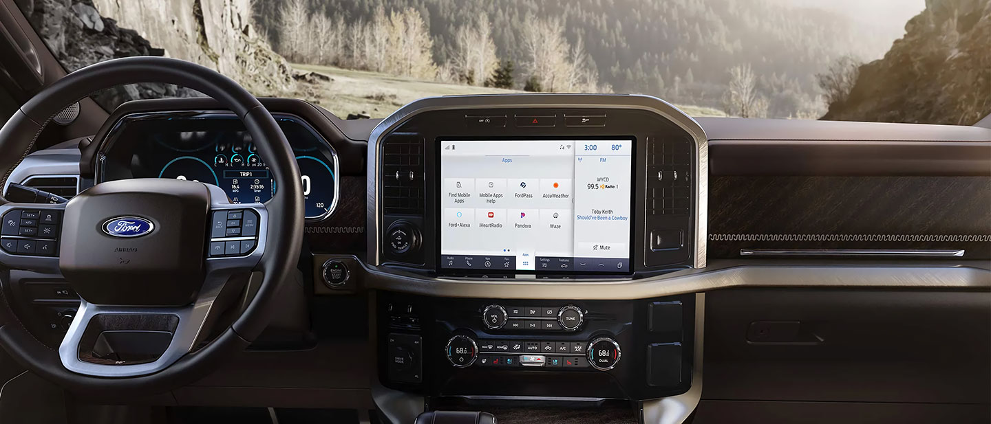 Interior view of a Ford showcasing the infotainment system and dashboard controls.