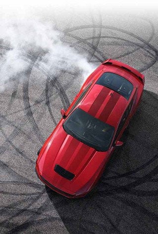 Overhead view of a 2024 Ford Mustang® model with tire tracks on pavement | Hines Park Ford in New Hudson MI