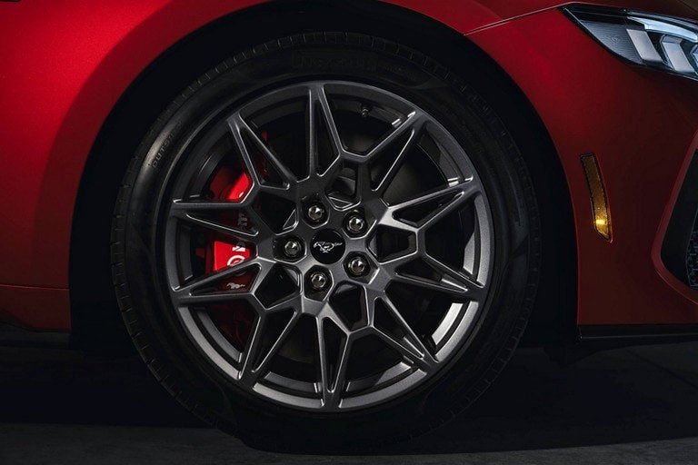2024 Ford Mustang® model with a close-up of a wheel and brake caliper | Hines Park Ford in New Hudson MI