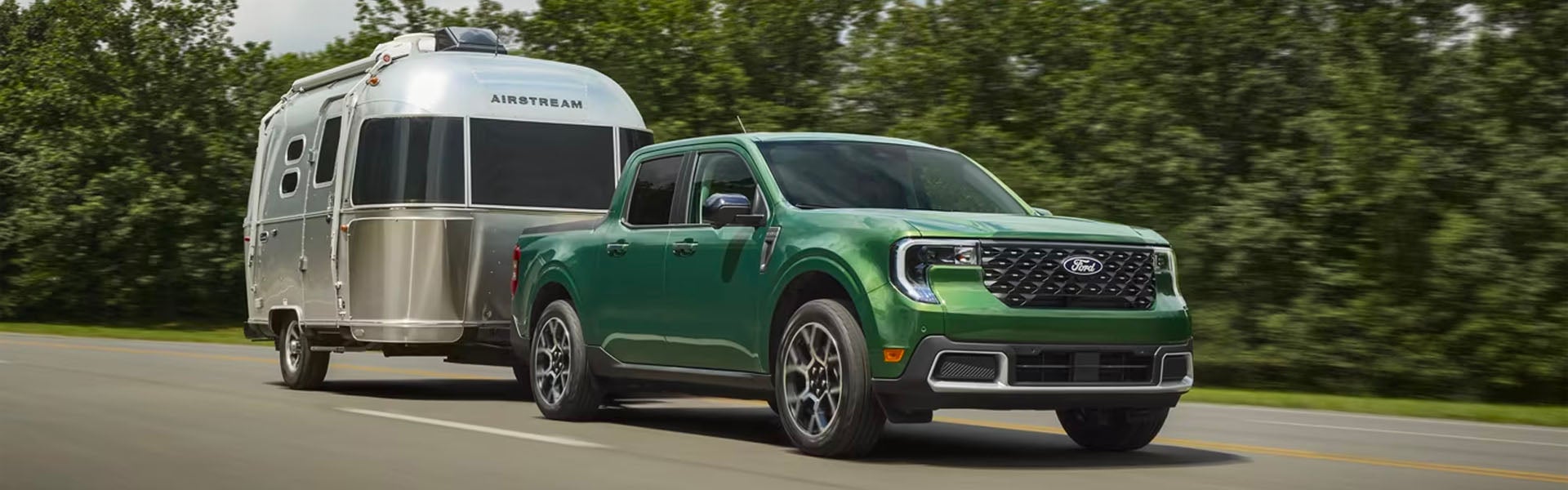 A driver at the wheel of their 2025 Ford Maverick in New Hudson, MI