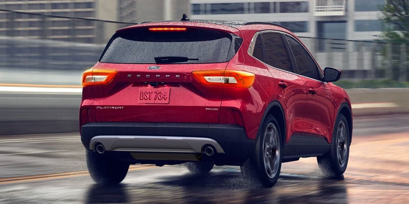 2026 Ford Escape in New Hudson, MI driving on I-96 with 2.0L EcoBoost engine and available AWD for Michigan roads
