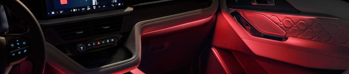 2026 Ford Explorer interior lighting in New Hudson, MI showing ambient LED lights and cabin visibility at night