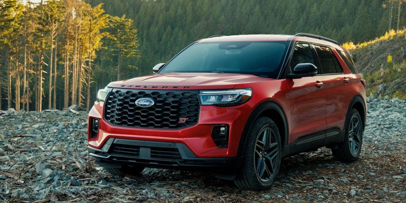 2026 Ford Explorer trims in New Hudson, MI including Active, ST-Line, Platinum, and ST models with wheels and exterior details