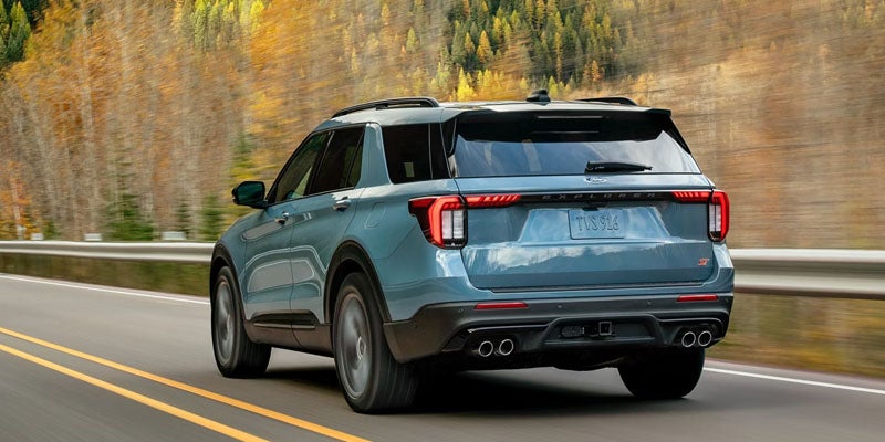 2026 Ford Explorer in New Hudson, MI driving on I-58, showcasing 400 hp V6 engine and all-wheel drive performance