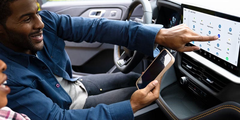 2026 Ford Explorer in New Hudson, MI showing Ford Co-Pilot360 safety features with blind spot monitoring and 360-degree camera