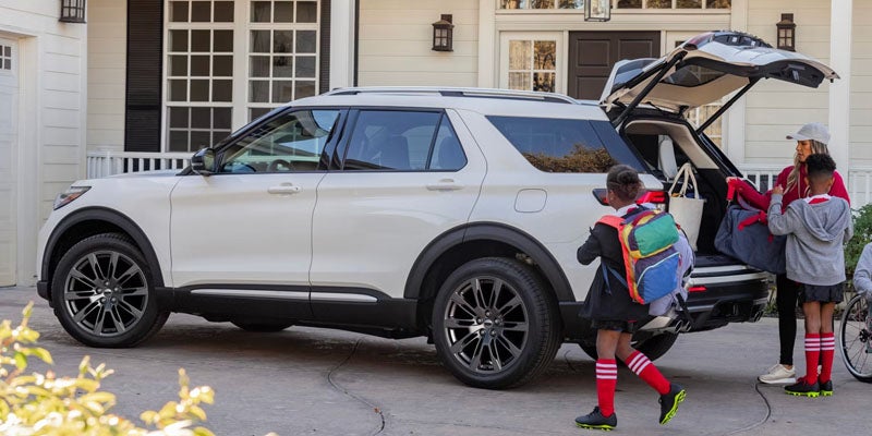 2026 Ford Explorer in New Hudson, MI parked outside a local soccer field, ready for family adventures
