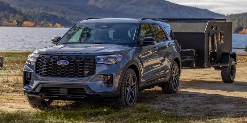 2026 Ford Explorer in New Hudson, MI parked off-road near scenic trails, perfect for weekend road trips