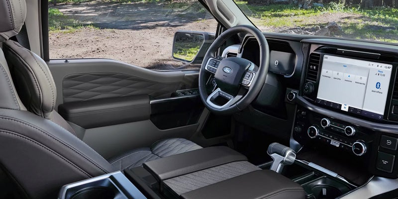 2026 Ford F-150 interior cabin in New Hudson MI with spacious seating, premium materials, and functional work-ready design for daily use and travel