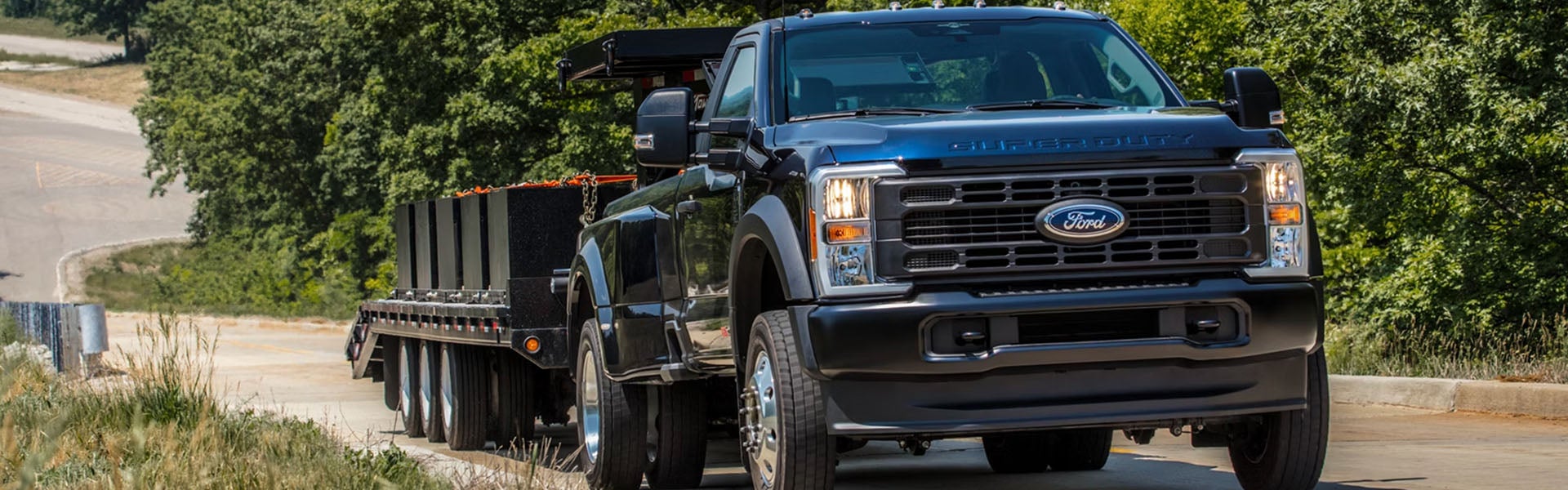 2026 Ford Super Duty center console controls in New Hudson MI showing integrated towing buttons, drive mode selectors, and advanced truck command interface