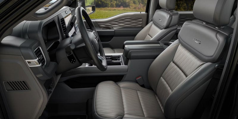 2026 Ford Super Duty interior cabin in New Hudson MI with heavy-duty seating, durable materials, and work-focused truck design
