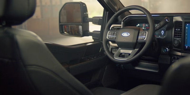 2026 Ford Super Duty interior technology in New Hudson MI featuring SYNC 4 display, towing assistance tools, and digital driver interface
