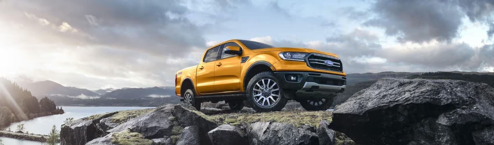 Ford F-250 sitting atop mountain - Ford cars review